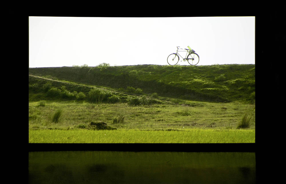 A screen displaying a bicycle on a hill.